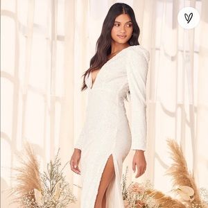 White sequence dress w/slit and low v cut.